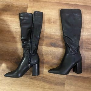 Tall black boots.Come right below knee-Only worn a few times- in new condition.